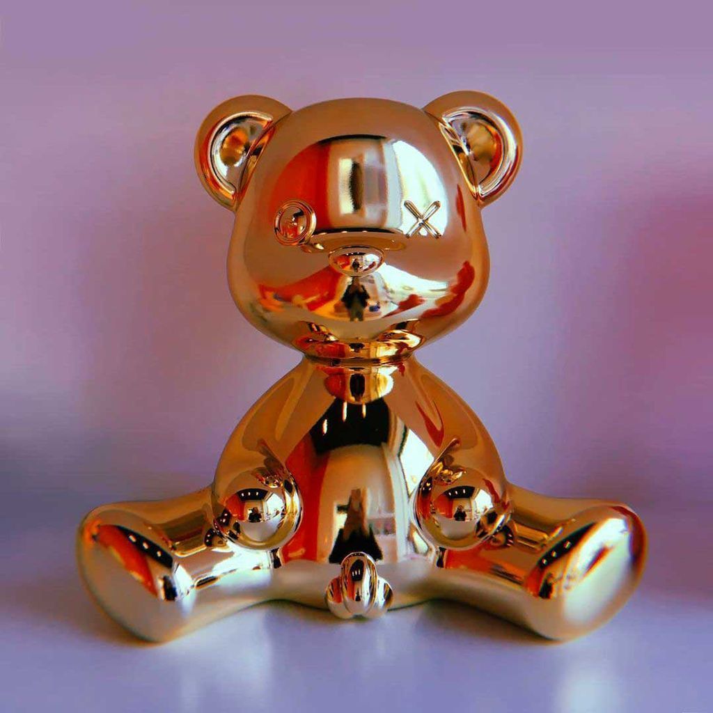 Lámpara de mesa de chico de peluche Qeeboo con acabado de metal por cable, oro