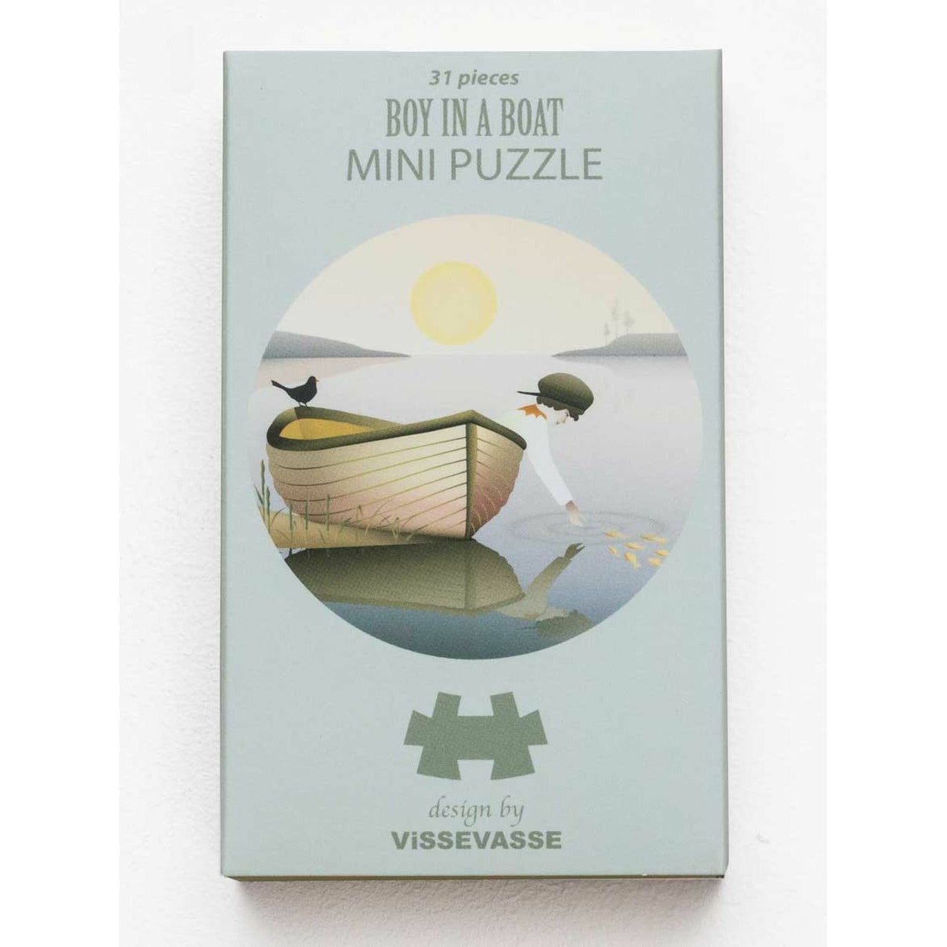 Vissevasse -Junge in einem Boot Mini -Puzzle